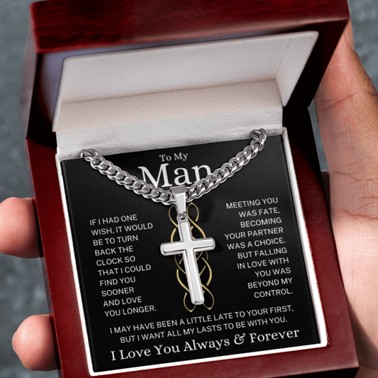 Necklace with cross pendant in a gift box held by a hand